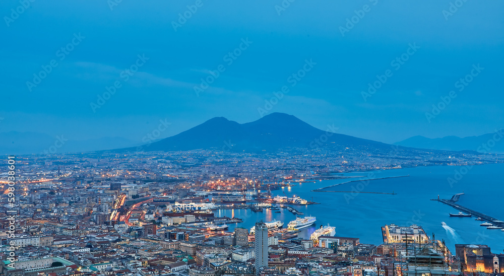 Naples, Italy. Beautiful sunset lights over the Naples' Bay with the marina