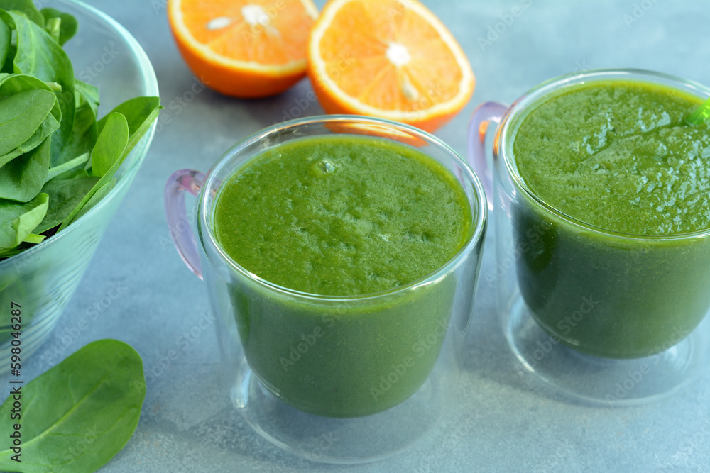 Fresh spinach, banana and orange fruit smoothie. Detox green drink Fresh spinach, banana and orange fruit smoothie. Detox green drink