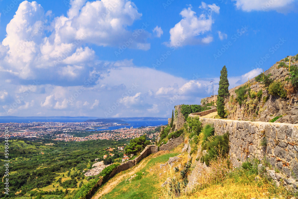 Summer landscape - view of the Klis Fortress and the city of Split, on the Adriatic coast of Croatia