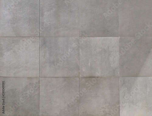 Elegant large gray square stone tiles. Background and texture
