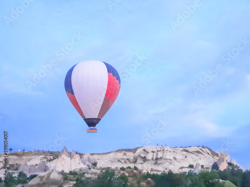 Process of launching many colored beautiful balloons into air in Cappadocia in mountains early at dawn. Filling balloon with hot air from burner, preparing basket. Excursion,flight for tourists above