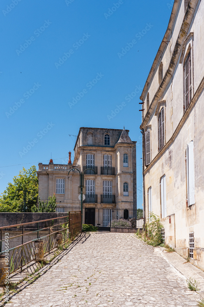 A cobbled street in a small French town.