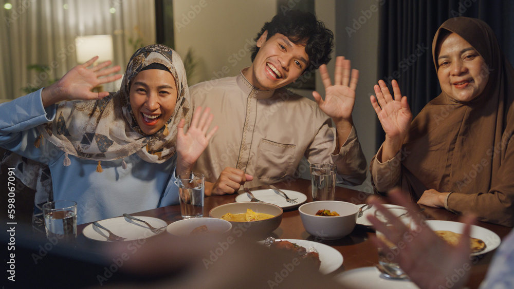 Happy Asian muslim family celebrate long distance with cousin use cell ...