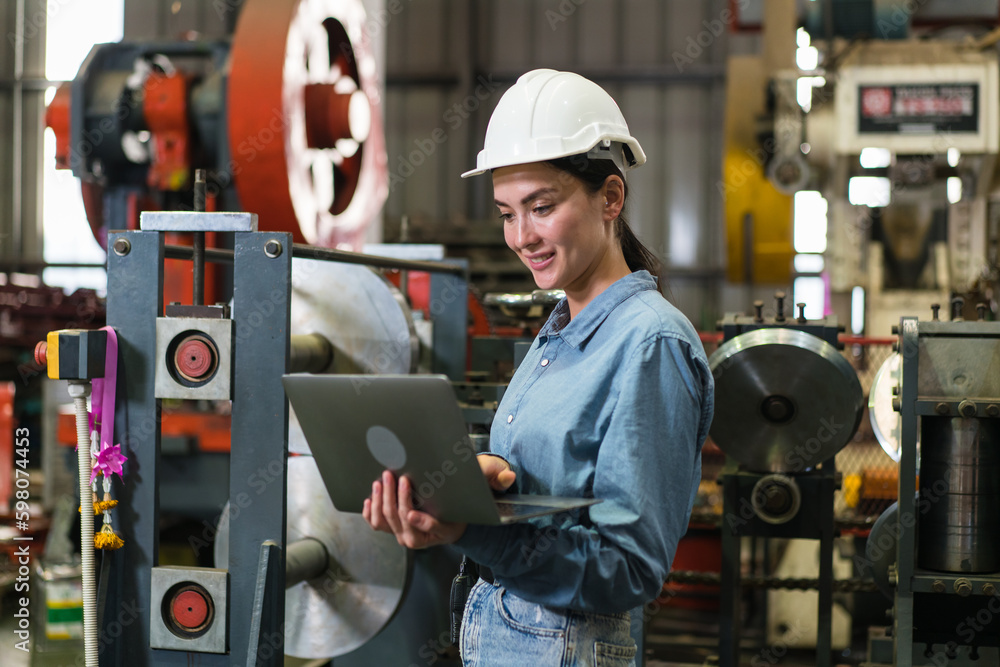 The project manager and engineers are inspecting workpieces and checking standards and safety for products and safety in the factory. Technician and Female Worker Talking on a Meeting in a Factory. The project manager and engineers are inspecting workpieces and checking standards and safety for products and safety in the factory. Technician and Female Worker Talking on a Meeting in a Factory.