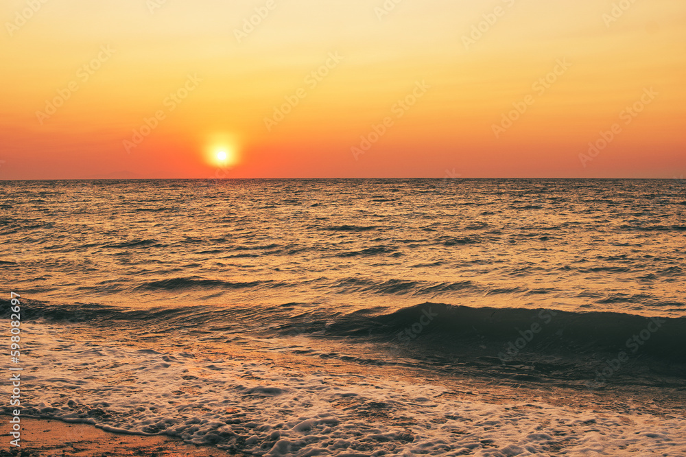 Sunset over Mediterranean Sea seen from a beach at Rhodes island