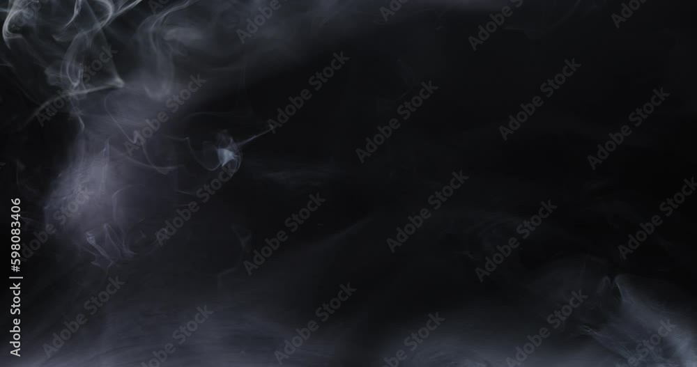 Abstract image of dark room concrete floor. Black room or stage background for product placement.Panoramic view of the abstract fog. White cloudiness, mist or smog moves on black background. Abstract image of dark room concrete floor. Black room or stage background for product placement.Panoramic view of the abstract fog. White cloudiness, mist or smog moves on black background.