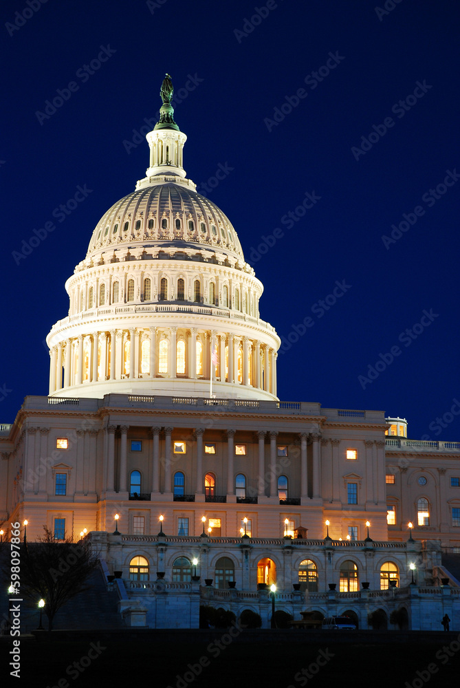 The dome of the Capitol Building is illuminated at night in Washington DC