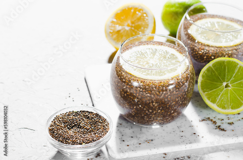 Chia Infused Water with Lemon, Healthy Citrus Drink on Bright Background