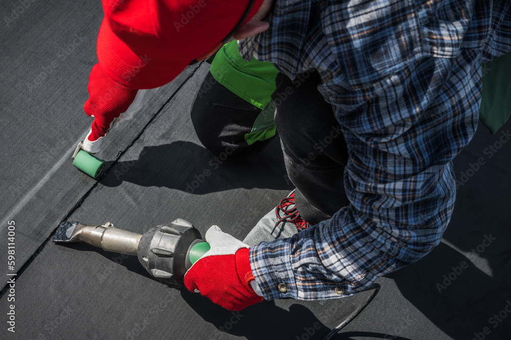 © Tomasz Zajda - Hot Air Blower Using For EPDM Roof Membrane Rubber Installation © Tomasz Zajda - Hot Air Blower Using For EPDM Roof Membrane Rubber Installation