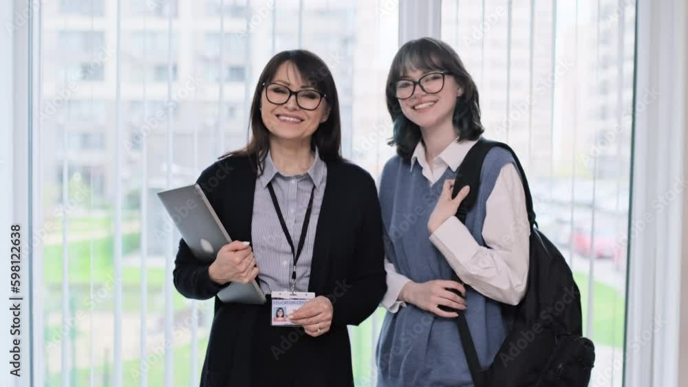 Portrait of middle aged female teacher and girl college student Portrait of middle aged female teacher and girl college student