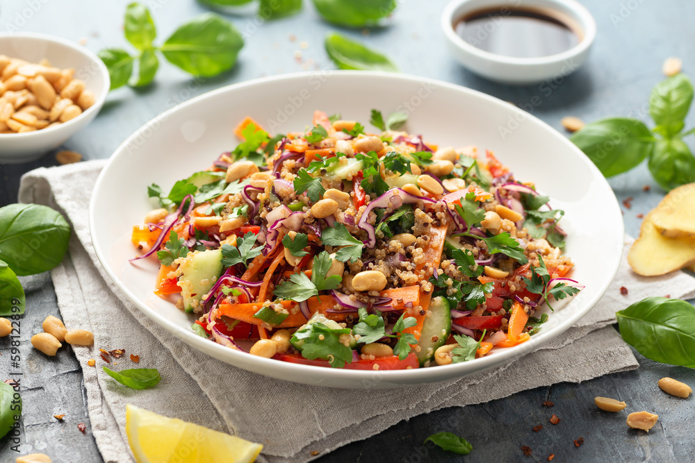 Asian Quinoa salad with fresh vegetables, peanuts and herbs. Healthy food. Asian Quinoa salad with fresh vegetables, peanuts and herbs. Healthy food.