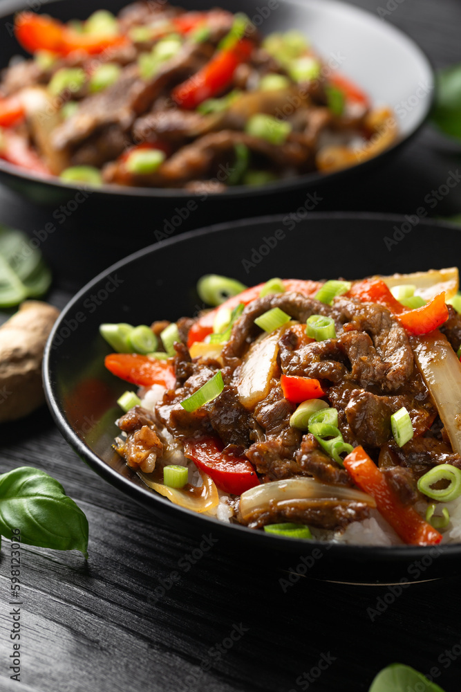 Stir fry Crispy Orange Beef with sweet peppers, onion and rice. Asian food Stir fry Crispy Orange Beef with sweet peppers, onion and rice. Asian food