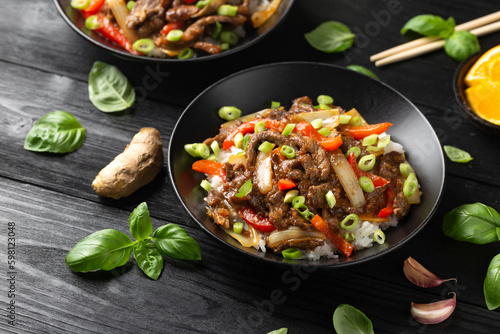 Stir fry Crispy Orange Beef with sweet peppers  onion and rice. Asian food