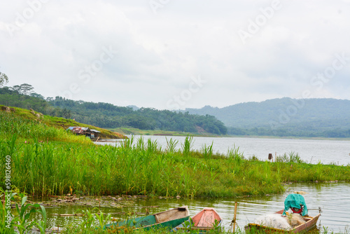 Overhead view of fishing gear, wooden boat, fishing nets, fishing tackle. View by the lake