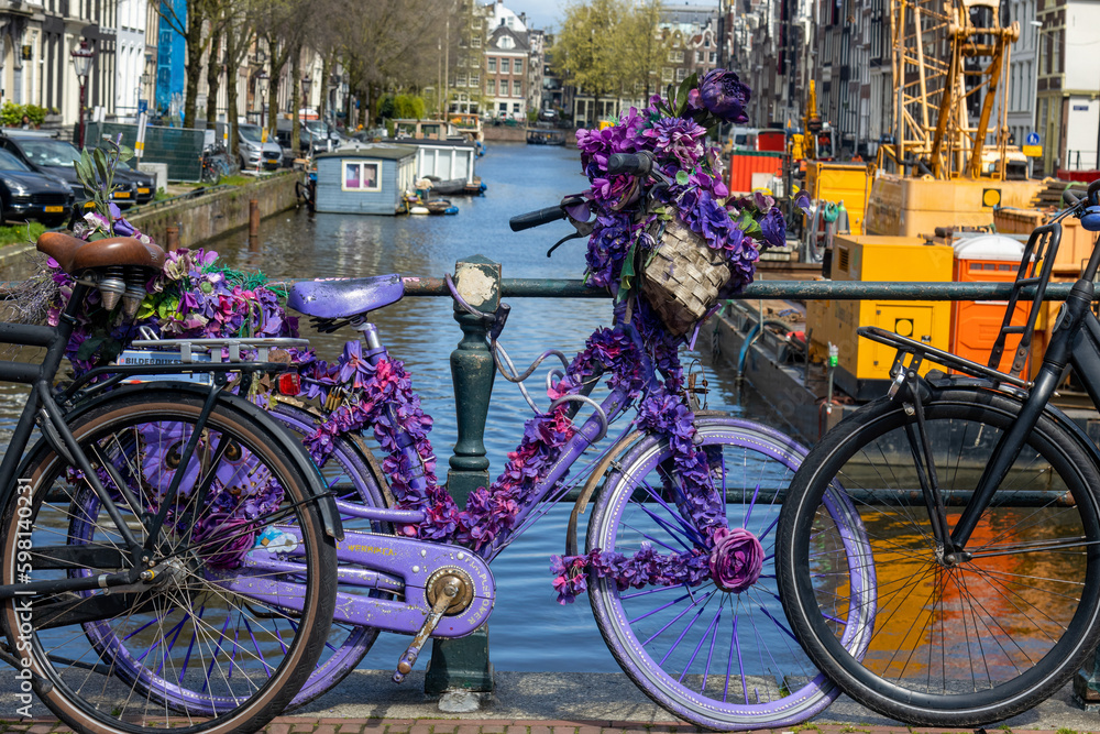 Bicycles decorated in different colours in Amsterdam
