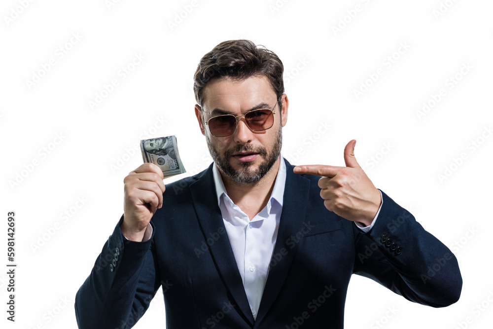 Man in suit holding cash money in dollar banknotes on isolated white background. Studio portrait of businessman with dollar banknotes. Dollar money. Career wealth business. Cash dollar concept. Man in suit holding cash money in dollar banknotes on isolated white background. Studio portrait of businessman with dollar banknotes. Dollar money. Career wealth business. Cash dollar concept.