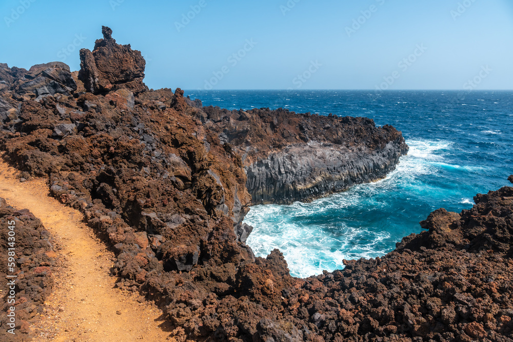 Volcanic trail in the village of Tamaduste on the coast of the island of El Hierro, Canary Islands, Spain