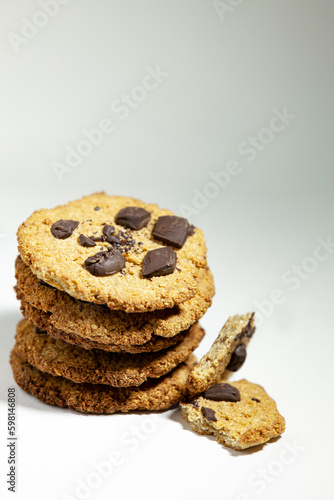 Handmade cookies for a healthy breakfast. Homemade oatmeal cookies with dark chocolate on a light background.