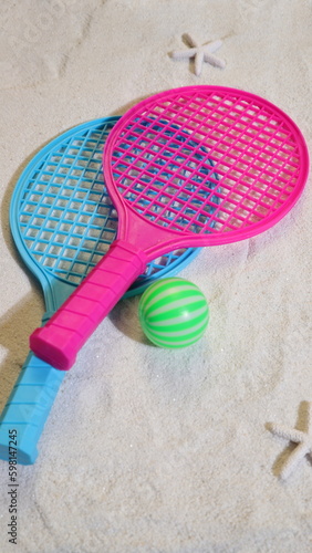 Beach tennis set on sand, summer sport activity © Olga