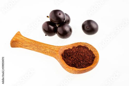 Acai berry powder in spoon - Euterpe oleracea photo