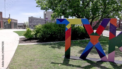 TXK sign on the Texas and Arkansas state line in Texarkana with gimbal video panning left to right. photo