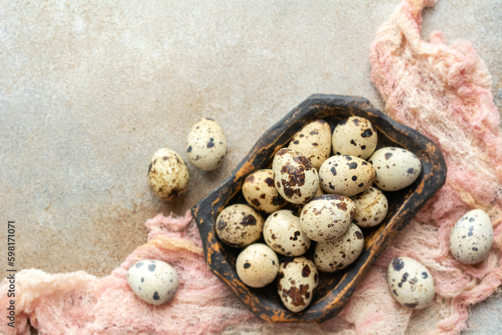 Fresh quail eggs in a wooden plate. Healthy food. View from above. Fresh quail eggs in a wooden plate. Healthy food. View from above.