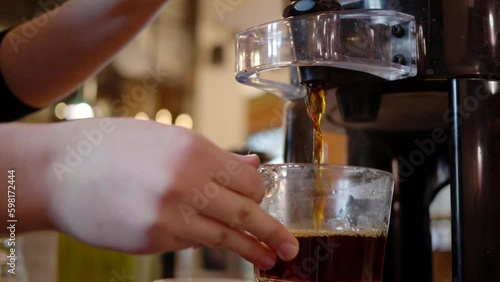 Wallpaper Mural A barista pours hot coffee into a glass Torontodigital.ca
