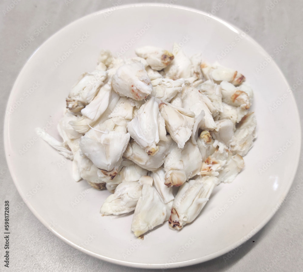 Full plate of steamed fresh stone crab meat, Cheliped of the crab, prepared raw shell animal at homemade gourmet restaurant Full plate of steamed fresh stone crab meat, Cheliped of the crab, prepared raw shell animal at homemade gourmet restaurant