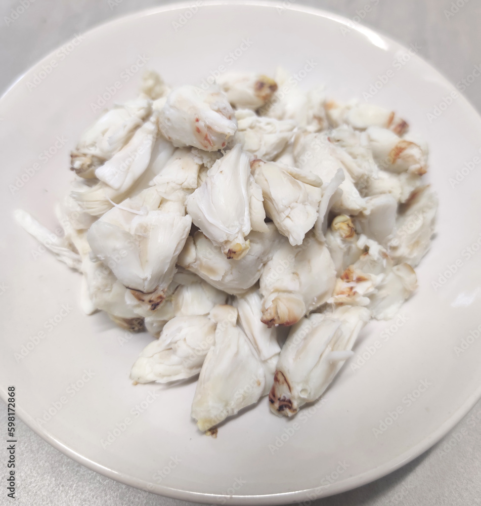 Full plate of steamed fresh stone crab meat, Cheliped of the crab, prepared raw shell animal at homemade gourmet restaurant Full plate of steamed fresh stone crab meat, Cheliped of the crab, prepared raw shell animal at homemade gourmet restaurant
