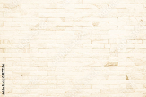 Empty background of wide cream brick wall texture. Beige old brown brick wall concrete or stone textured  wallpaper limestone abstract. 