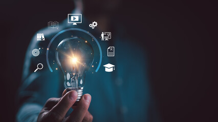 E-learning graduate certificate program concept. man holding lightbulb showing graduation hat, Internet education course degree, study knowledge to creative thinking idea and problem solving solution