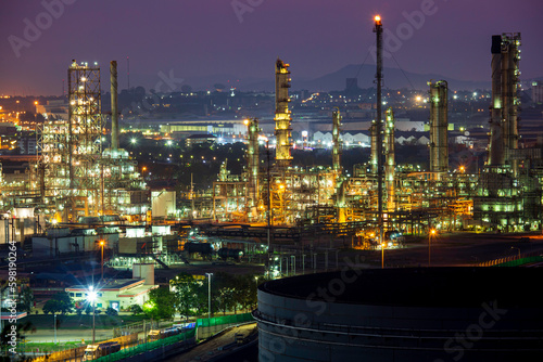 Morning sun orange scene of oil refinery plant and tower column oil of Petrochemistry mountain