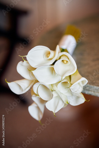 wedding rings on a bouquet of flowers