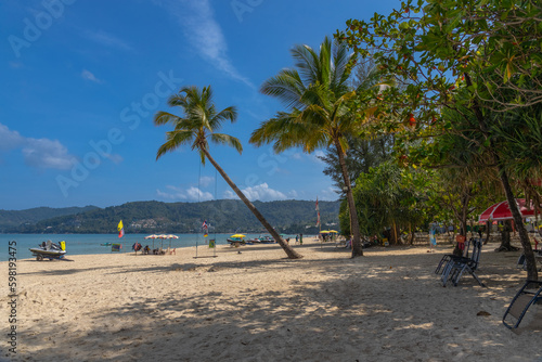 Patong Beach Phuket Thailand nice white sandy beach clear blue and turquoise waters and lovely blue skies with Palms tree © Elias Bitar