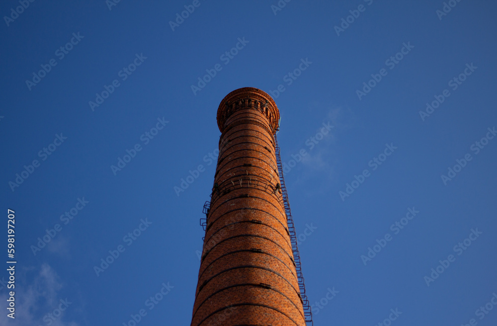 Industrial pipe against sky