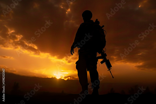 A black silhouette of an american soldier patrolling the sunset