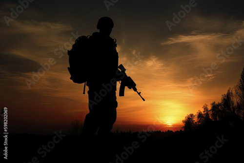 A black silhouette of an american soldier patrolling the sunset