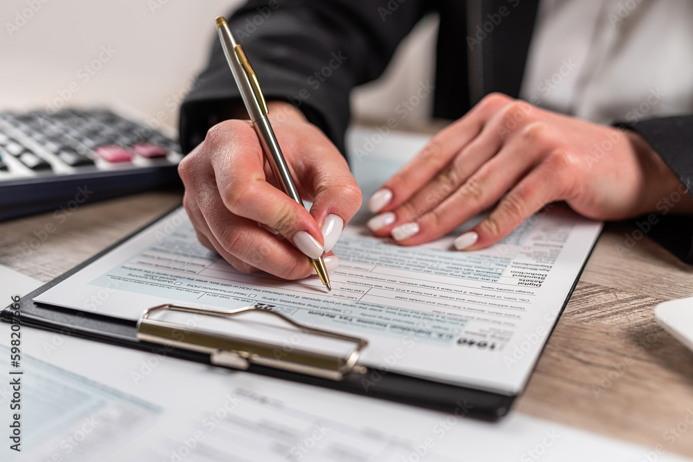 woman working with business report document , filling tax form, accounting woman working with business report document , filling tax form, accounting