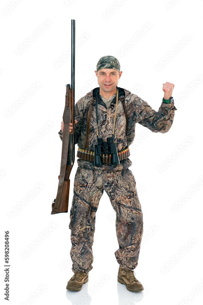 Full lengt portrait of happy duck hunter with a rifle and binoculars winning the prize, isolated on white background. Fifty-year-old man in hunting uniform standing in studio. Full lengt portrait of happy duck hunter with a rifle and binoculars winning the prize, isolated on white background. Fifty-year-old man in hunting uniform standing in studio.