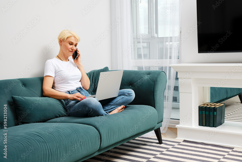 Middle-aged woman solves everyday problems remotely Middle-aged woman solves everyday problems remotely