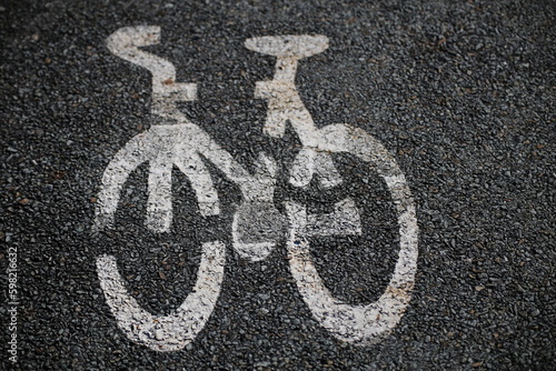 Bicycle Path Sign Image Painted on Black Road