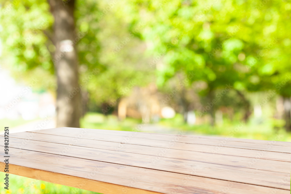 light wooden table on blurred nature bokeh background light wooden table on blurred nature bokeh background