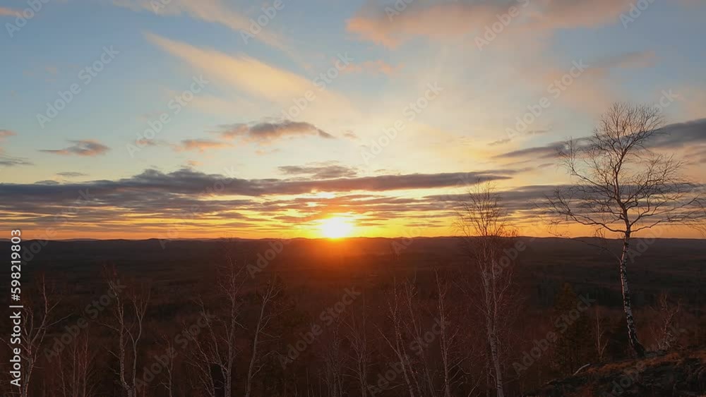 Beautiful sunset over the mountain range. Trees, sky, clouds. Beautiful sunset over the mountain range. Trees, sky, clouds.