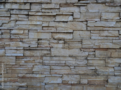Natural stone wall texture as background for interior, exterior decoration and industrial construction concept design. Close-up 