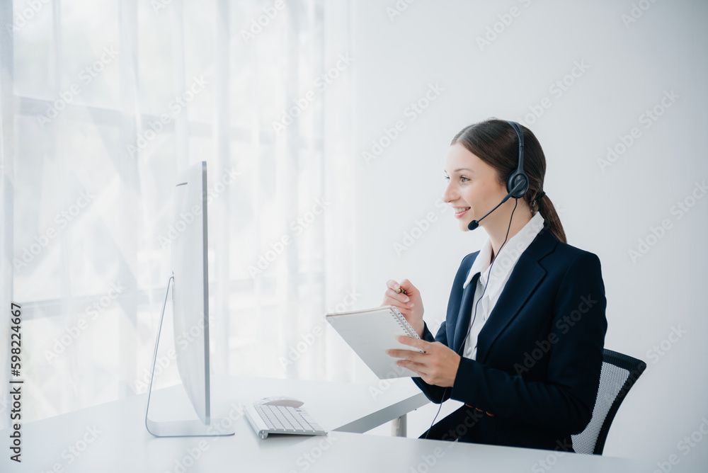 Serious call center operator in wireless headset talking with customer, woman in headphones with microphone consulting client on phone in customer support service in business center. Serious call center operator in wireless headset talking with customer, woman in headphones with microphone consulting client on phone in customer support service in business center.