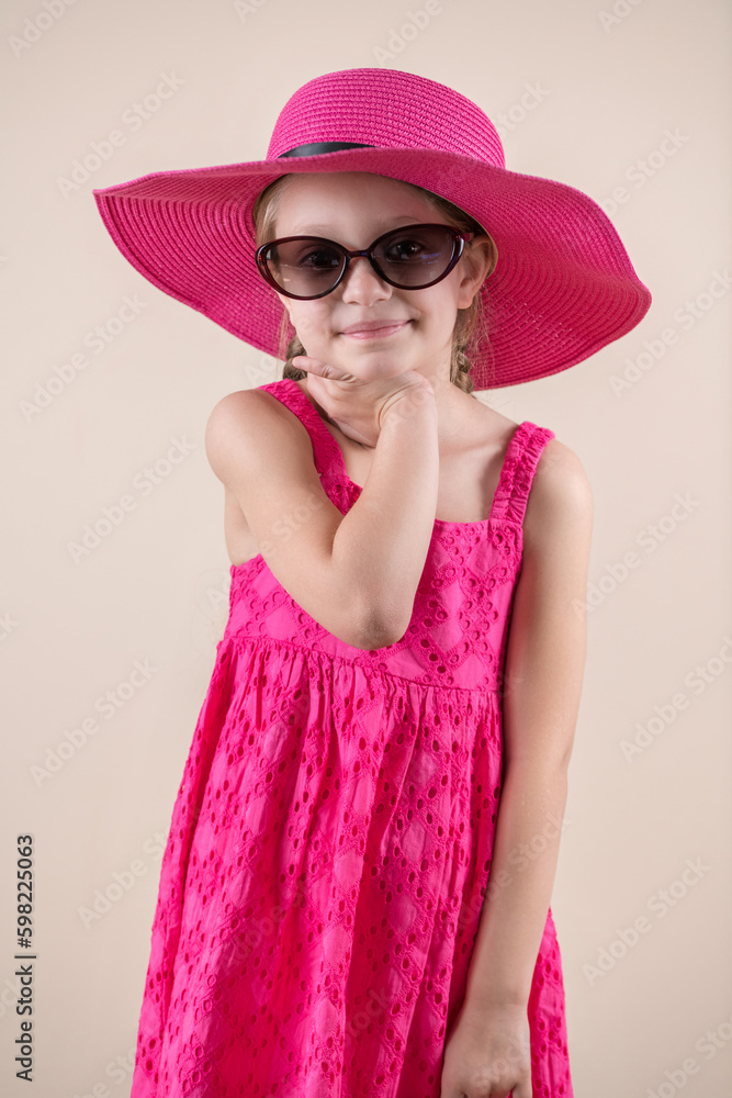 Little girl with red hat and sunglasses Little girl with red hat and sunglasses