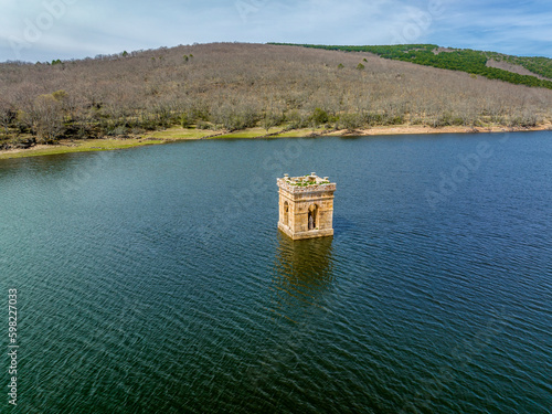 Cuerda del Pozo reservoir on the Duero river view of the bell tower of the church of La Muedra Soria province photo