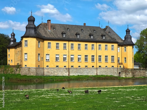 Romantic yellow water castle Schloss Dyck in Juechen in Germany photo