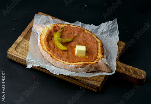 Traditional Georgian pastry - khachapuri with cheese and ingredients. Georgian cuisine photo