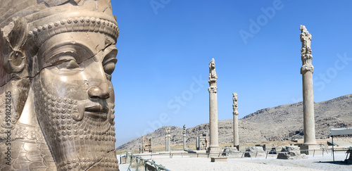  Horizontal banner with columns of Apadana Palace built by Darius the Great and face of assyrian protective deity lamassu - human-headed winged bull, Persepolis, Iran photo